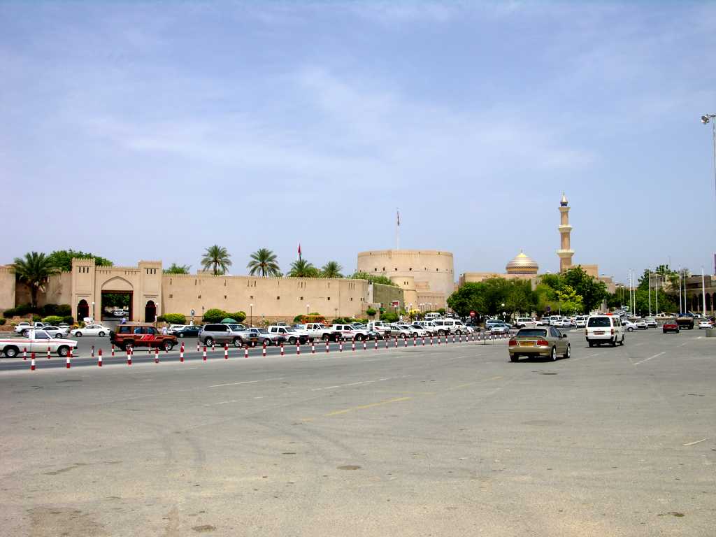 Muscat 06 Nizwa 01 Long View of Fort We took a private full day-tour to Jebel Shams via Nizwa and Misfah. Taxi drivers in Muscat later old us that they would have done the tour for about half of the amount the formal tour company charged. While coastal Oman was involved in a lucrative sea trade with Zanzibar, India and China in medieval times, inland Nizwa (174km from Muscat) was the seat of the imams who ruled much of the interior. Nizwa is famous as the headquarters of Sinbad the Sailor, and the city is also blessed with an imposing 17C fort, recently restored.